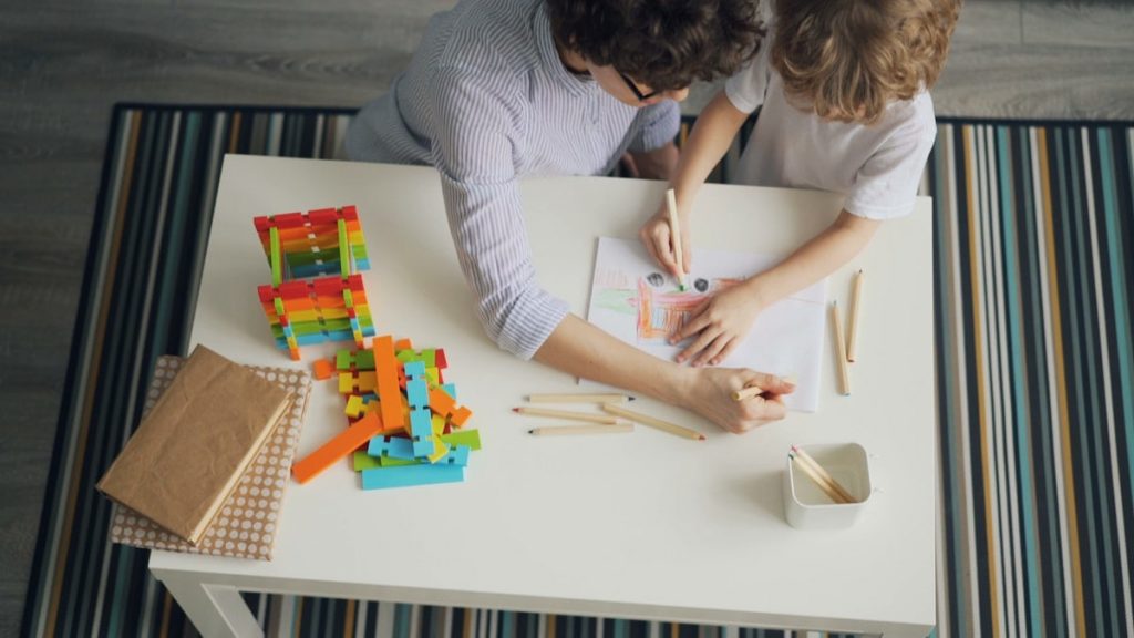 a couple of people that are sitting at a table